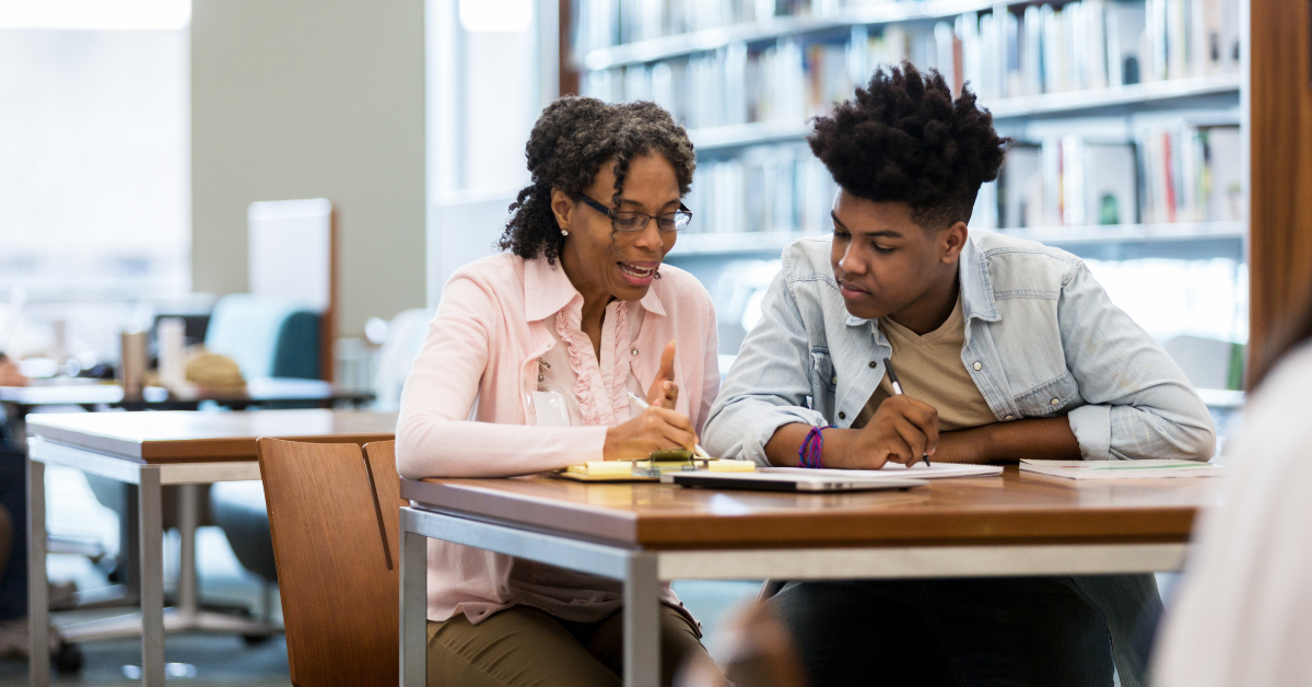 Student and teacher in the classroom working on projects