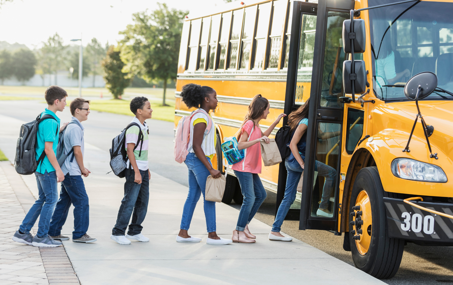 Kids getting onto a school bus